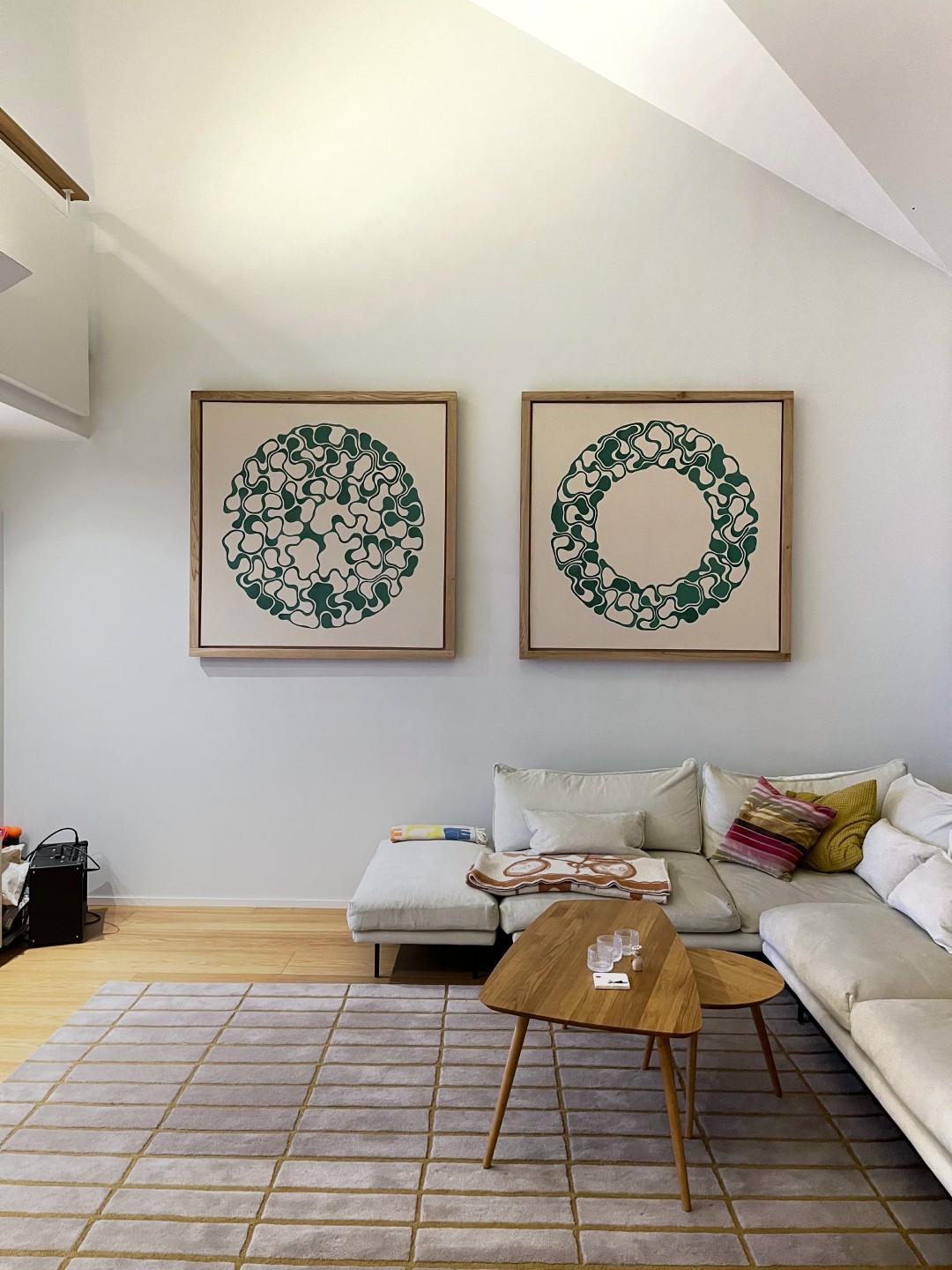 Large-scale abstract paintings installed in a modern interior space